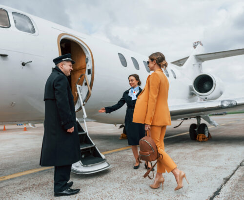 Young woman boarding a private jet