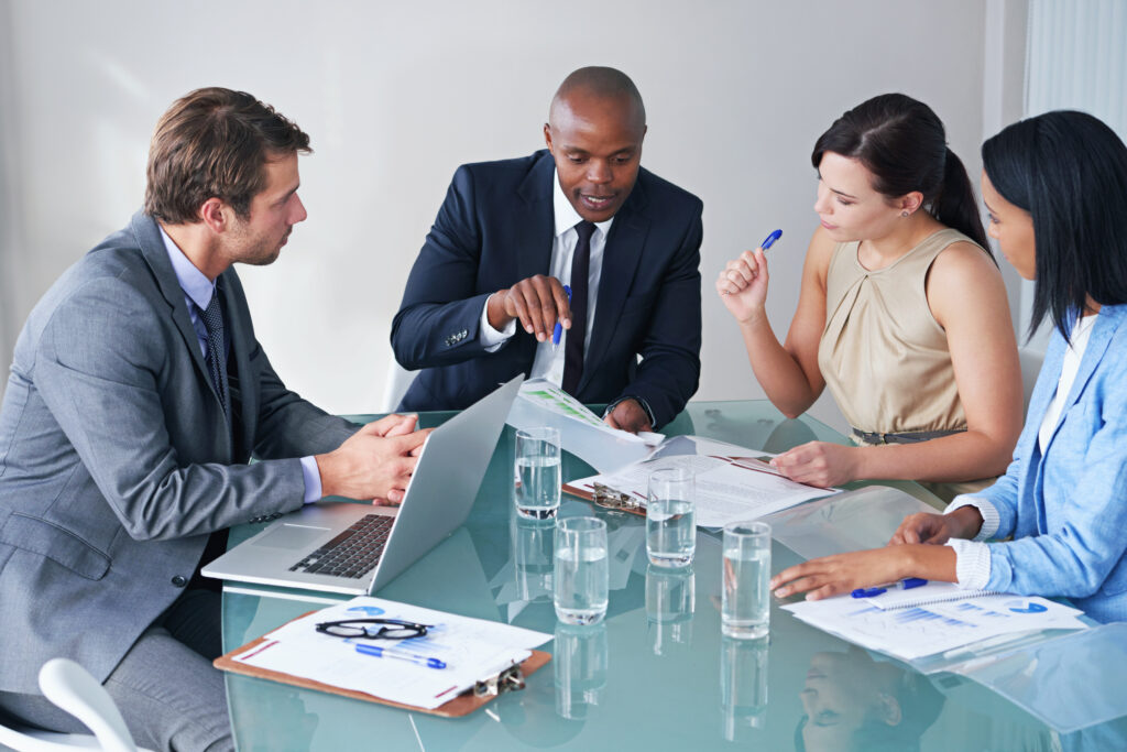 A business team on a meeting discussing the details of the repatriation of a body.