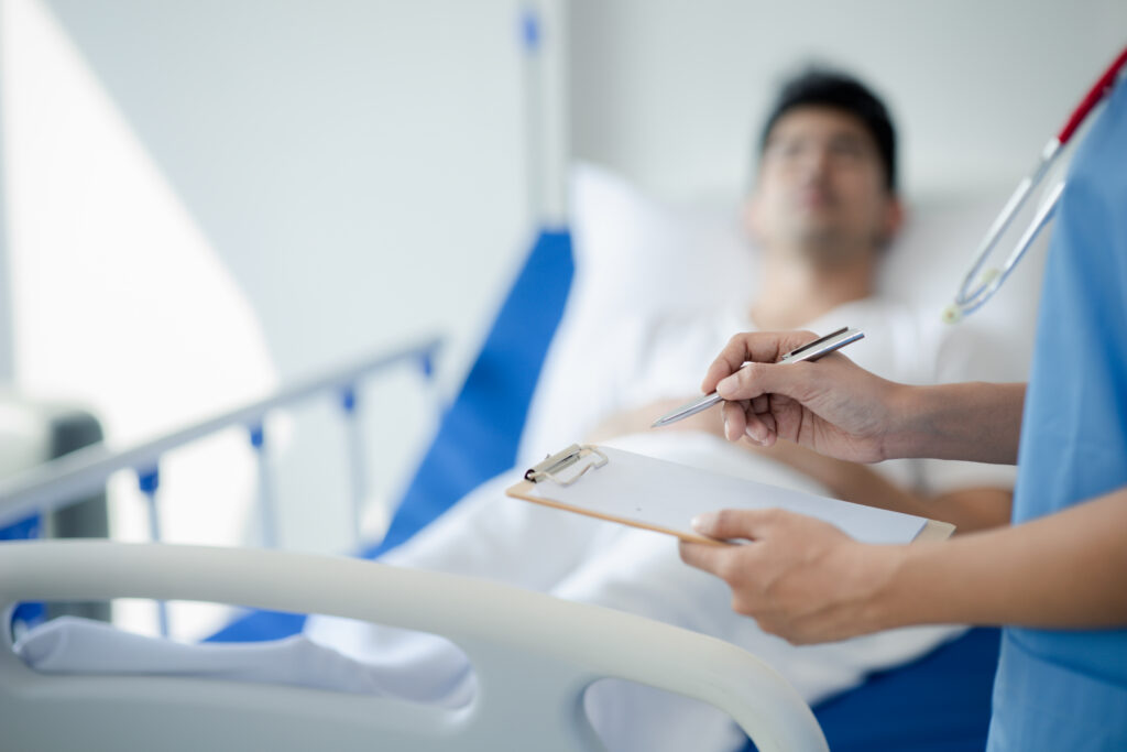Doctor conducting hospital discharge evaluation to patient after their condition improved.