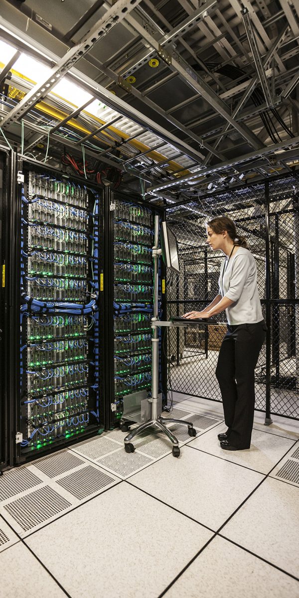 woman technician working on computer servers