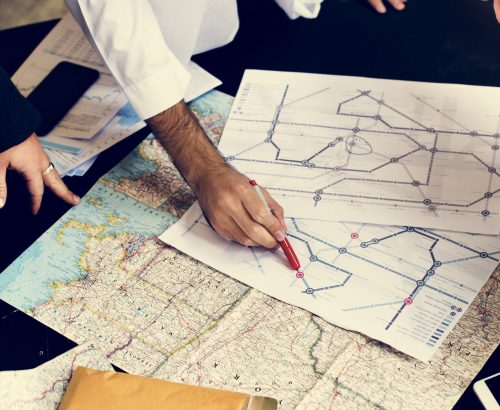 Emergency response team using map to plan evacuation routes.