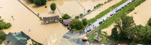 A flood has caused a road block, a situation a response team would manage.